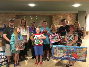 Allen Magie and Matt Adonis, joined by their families, visit the Children’s Hospital at Saint Peter’s. 