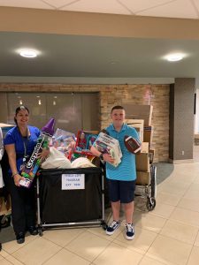 Allen Magie visits the Children’s Hospital at Saint Peter’s to drop off toys and games collected during his toy drive.