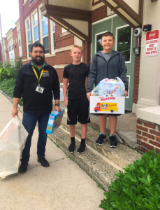 Allen Magie at Haskell Elementary School accompanied by Principal Kenneth Doolittle and fellow student and friend, Kyle Keyes.