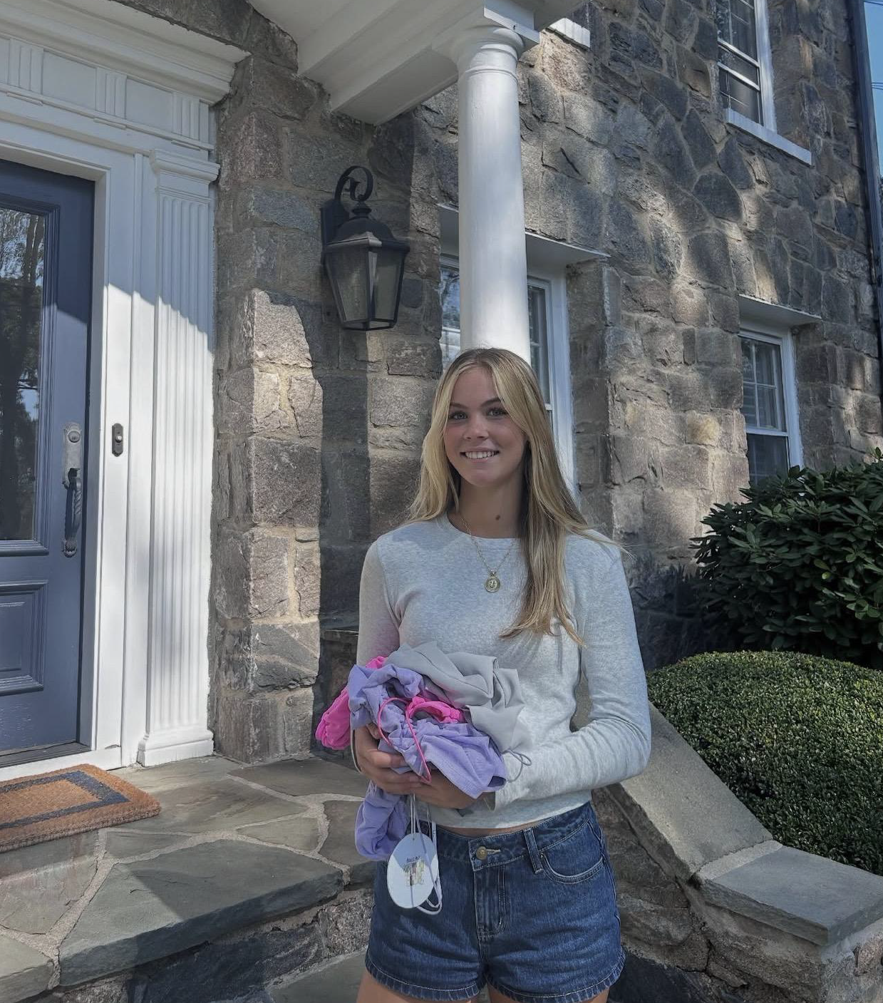 Molly FitzGerald with donated clothing