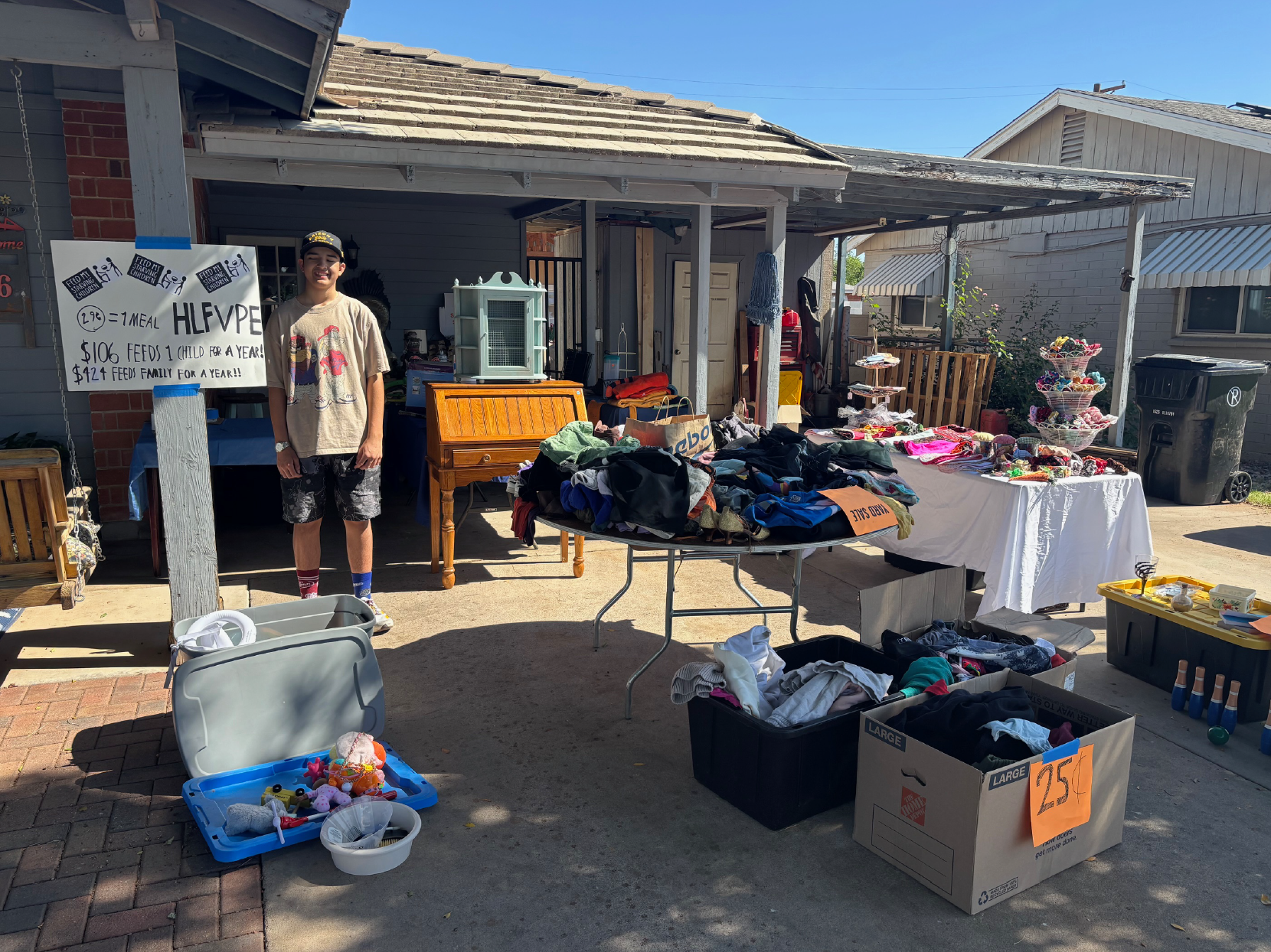 Grant Mendez at his yard sale fundraiser for Feed My Starving Children